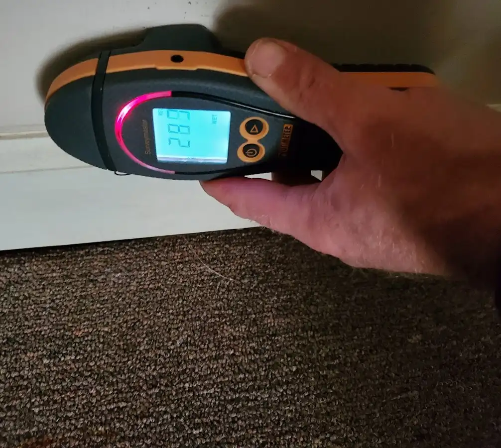 Moisture detection at baseboard during Storm Damage Restoration in Port Allen